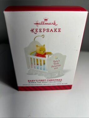 Hallmark Keepsake Winnie the Pooh 2014 Ornament “Baby’s First Christmas” in crib